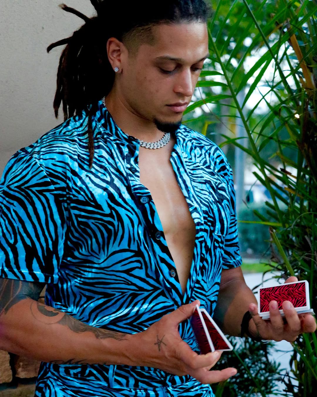 Maison Jay performing close-up card magic